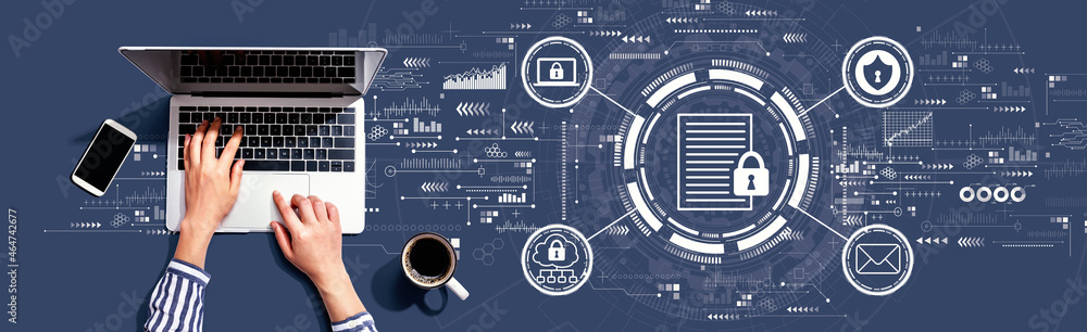 Data protection concept with person using a laptop computer Data protection concept with person using a laptop computer