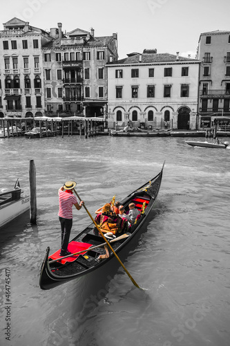 Tourists travel on gondolas at canal