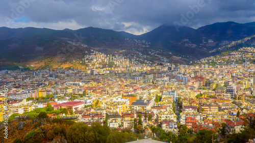  sunny view of Alanya against the backdrop of mountains and with beautiful clouds  © serhii