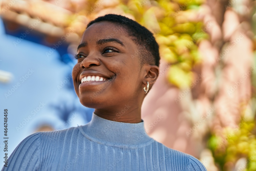Young african american woman smiling happy standing at the city. Young african american woman smiling happy standing at the city.