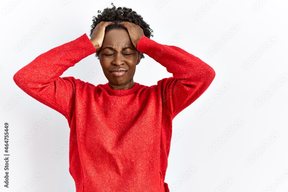Young african american woman wearing casual clothes over isolated background suffering from headache desperate and stressed because pain and migraine. hands on head. Young african american woman wearing casual clothes over isolated background suffering from headache desperate and stressed because pain and migraine. hands on head.