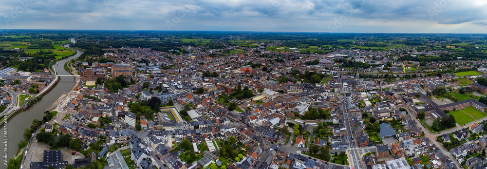 Aerial view around downtown of the city Wetteren in Belgian on a cloudy afternoon in summer