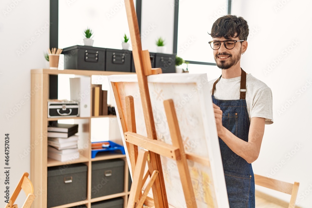 Young hispanic artist man smiling happy drawing at art studio. Young hispanic artist man smiling happy drawing at art studio.