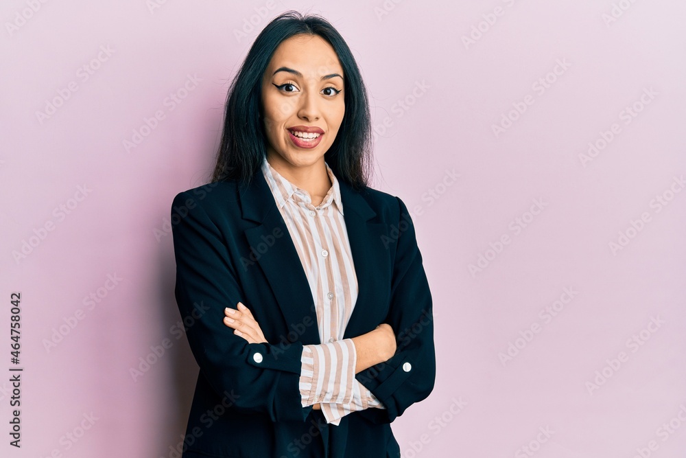 Young hispanic girl wearing business clothes with arms crossed celebrating crazy and amazed for success with open eyes screaming excited. Young hispanic girl wearing business clothes with arms crossed celebrating crazy and amazed for success with open eyes screaming excited.