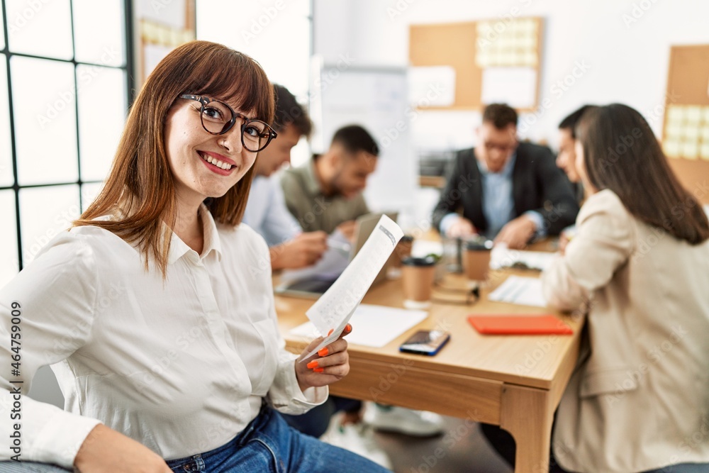 Group of business workers smiling happy working at the office. Group of business workers smiling happy working at the office.