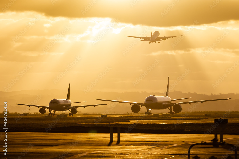 © Xiao - airplane taking off at sunset, airport traffic, airfraft taxing