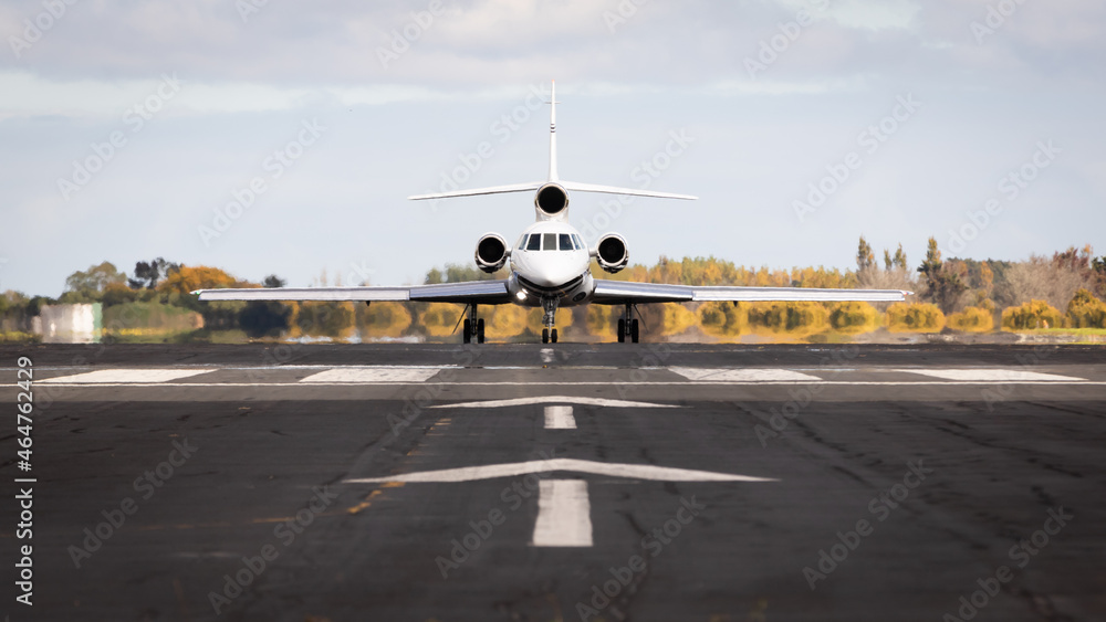 Fototapeta premium Jet plane taxing on the runway about to take off. Private business aircraft. Taking off, departure.