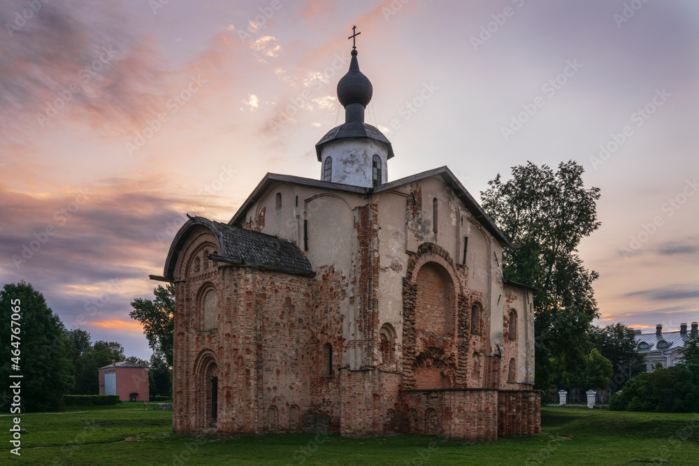 View of the Church of St. Paraskevi (Paraskevy Pyatnitsy na Torgu) on the territory of Yaroslavovo Dvorishche against the background of the dawn sky, Veliky Novgorod, Russia