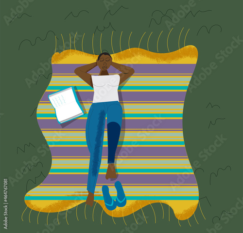 curvy woman relaxing outdoors on a blanket