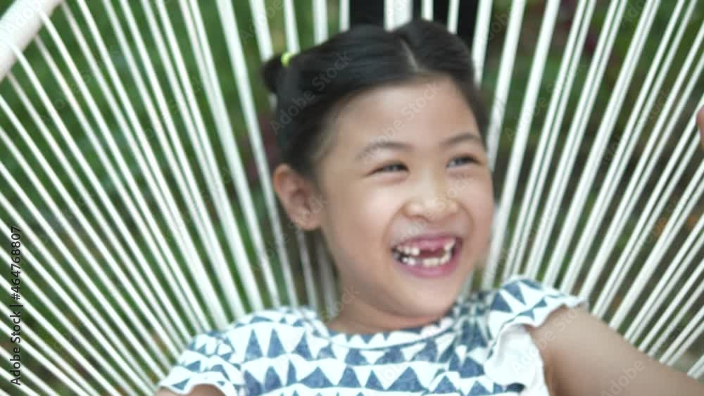 Asian girl children smiling with the baby teeth that have come out, dental concept.
Asian girl children smiling with the baby teeth that have come out, dental concept.