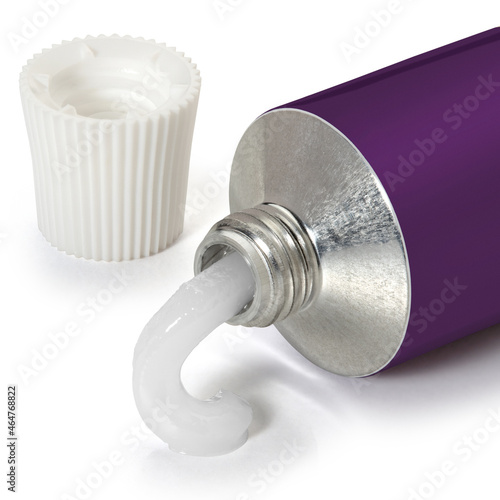 Open blue with yellow tube of ointment on a white background. Full depth of field. With clipping path.