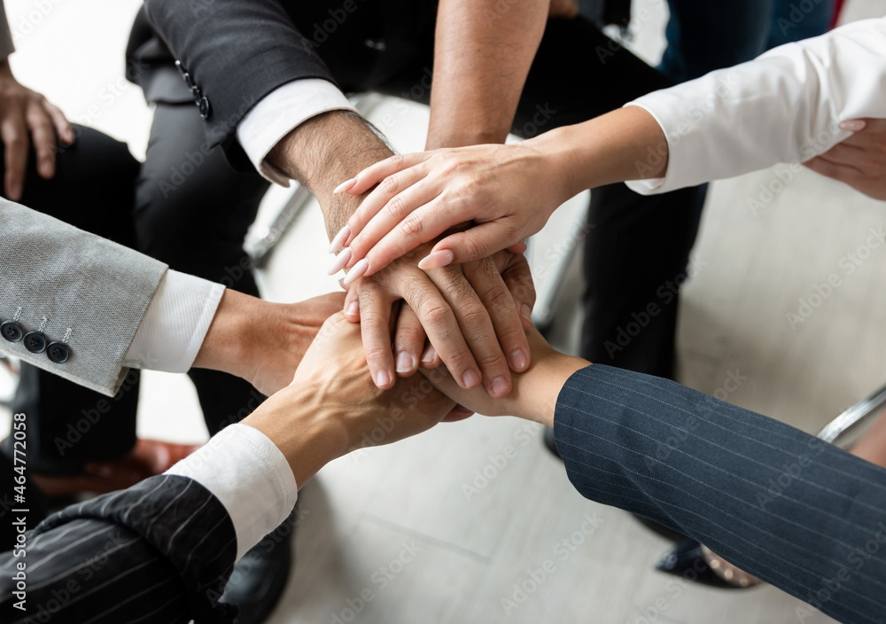 Power of the new generation, Team work, Join forces to achieve the goal. Business people, managers, employees shaking hands, energizing in a circle. Power of the new generation, Team work, Join forces to achieve the goal. Business people, managers, employees shaking hands, energizing in a circle.
