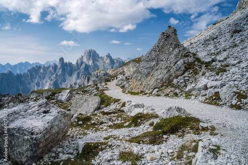 Hiking trail to Cime di Lavaredo with Cadini di Misurina mountain group in background. Dolomites, Italy