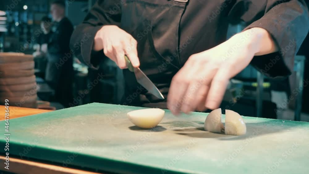 Close up of fresh onions getting chopped at the cafe Close up of fresh onions getting chopped at the cafe