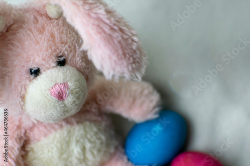 Easter pink bunny with blue eggs. Easter concept. © Ilia Petukhov