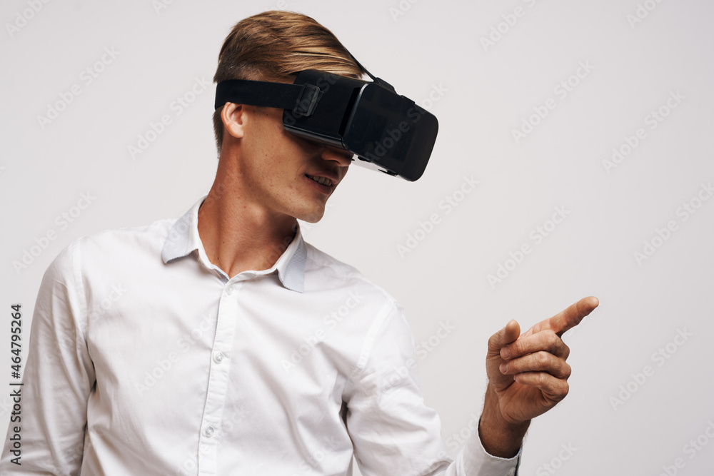 Man virtual reality glasses high-tech simulator technology studio
