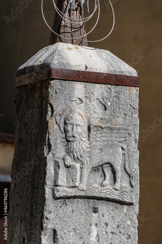 Base of Flagpole with venetian Lion in front of St. Servulus church in Buje, Istria, Croatia