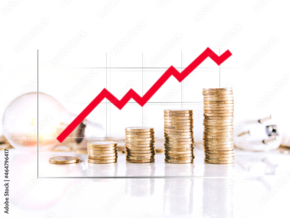 Graphic on coin towers showing the rise in the price of electricity. Selective focus Graphic on coin towers showing the rise in the price of electricity. Selective focus