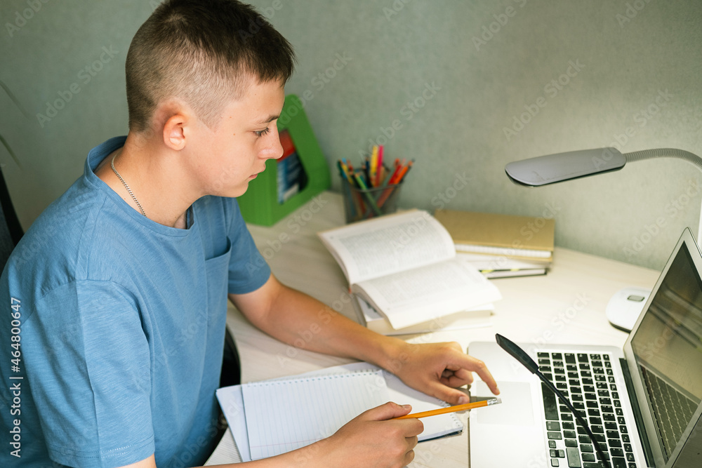 Laptop on the student's desk with the broadcast of the classroom. Laptop on the student's desk with the broadcast of the classroom.