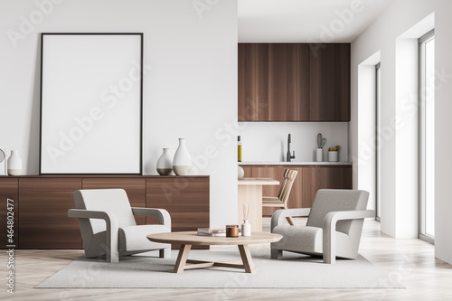 Standing canvas next to white wall in beige seating area and kitchen © ImageFlow