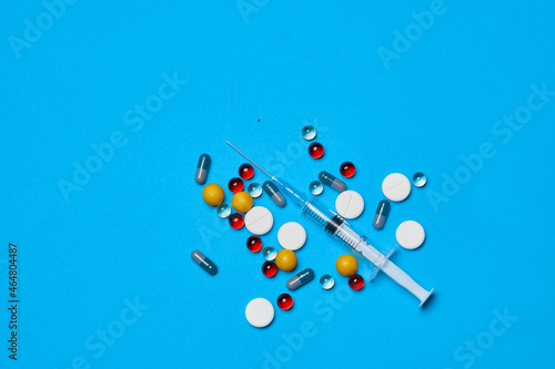 pain reliever Pharmaceuticals medicines syringe blue background