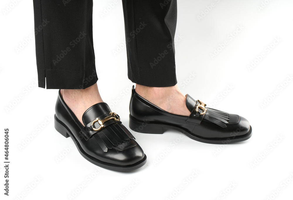 Loafers isolated on white background. Pair of Stylish Expensive Modern Leather Black Loafers Shoes. Fashion concept with woman shoes on white. Loafers isolated on white background. Pair of Stylish Expensive Modern Leather Black Loafers Shoes. Fashion concept with woman shoes on white.