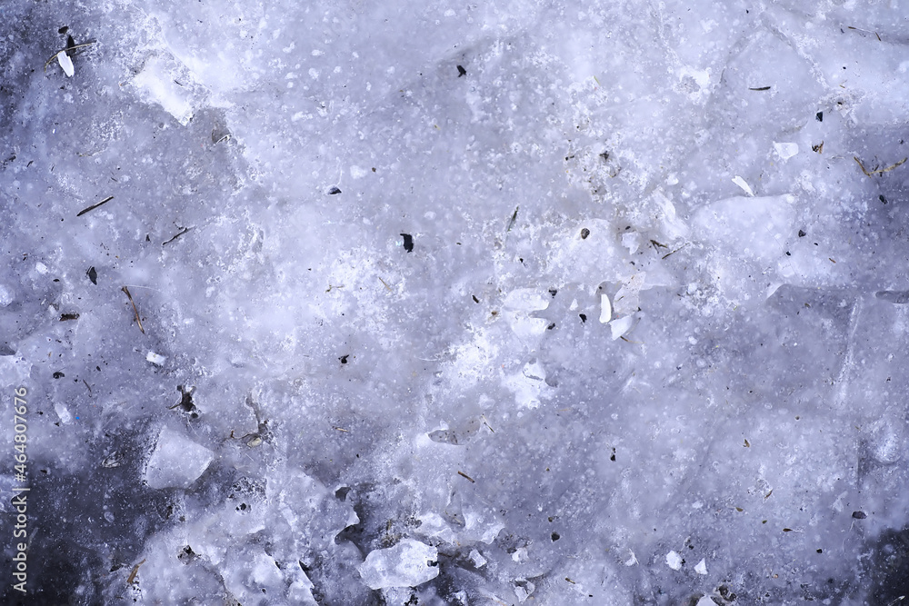Crashed ice concrete surface background texture. Frozen ice surface of a lake in sunset
