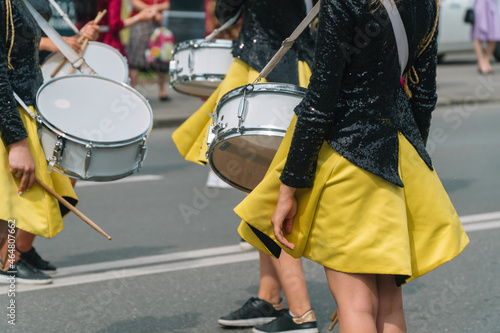 Young girls drummer at the parade. Street performance