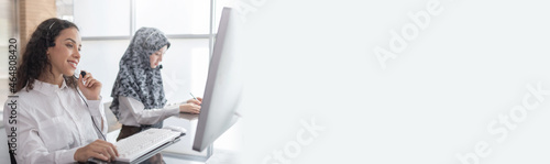 Wide banner. happy young female call center customer support executive team with headset working in office, education online, customer support service, call center, phone operator, video call concept