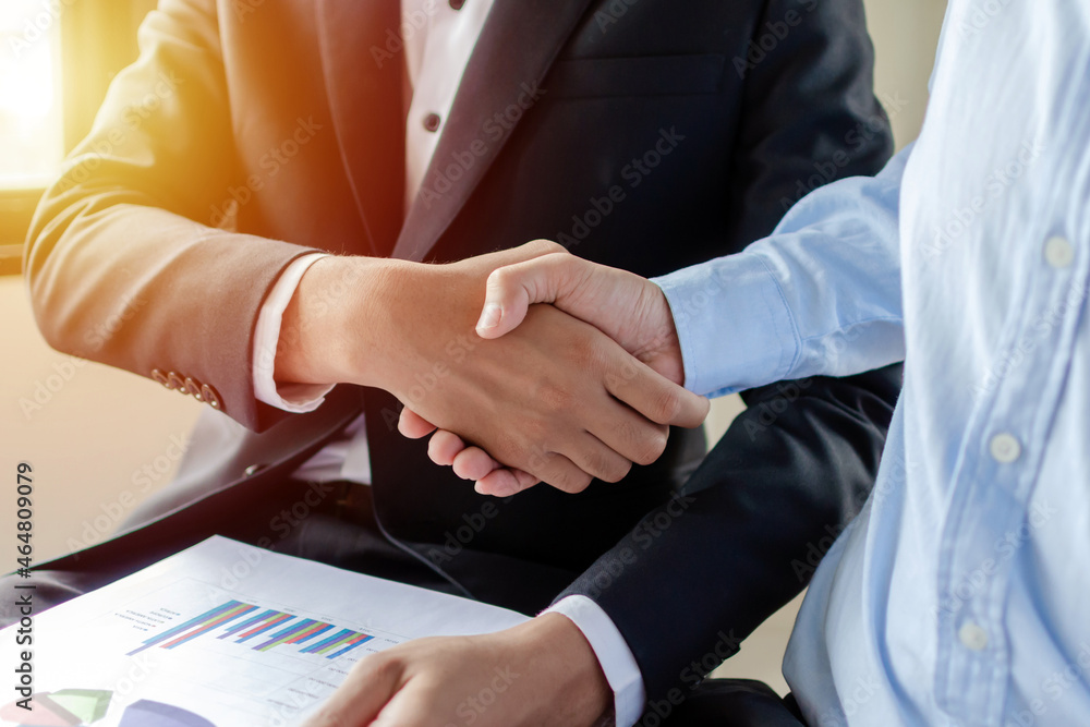 Obraz premium Partnership. two business man investor handshake deal with partner after finishing up business meeting in meeting room office, partner, financial, teamwork, job interview, contract agreement concept