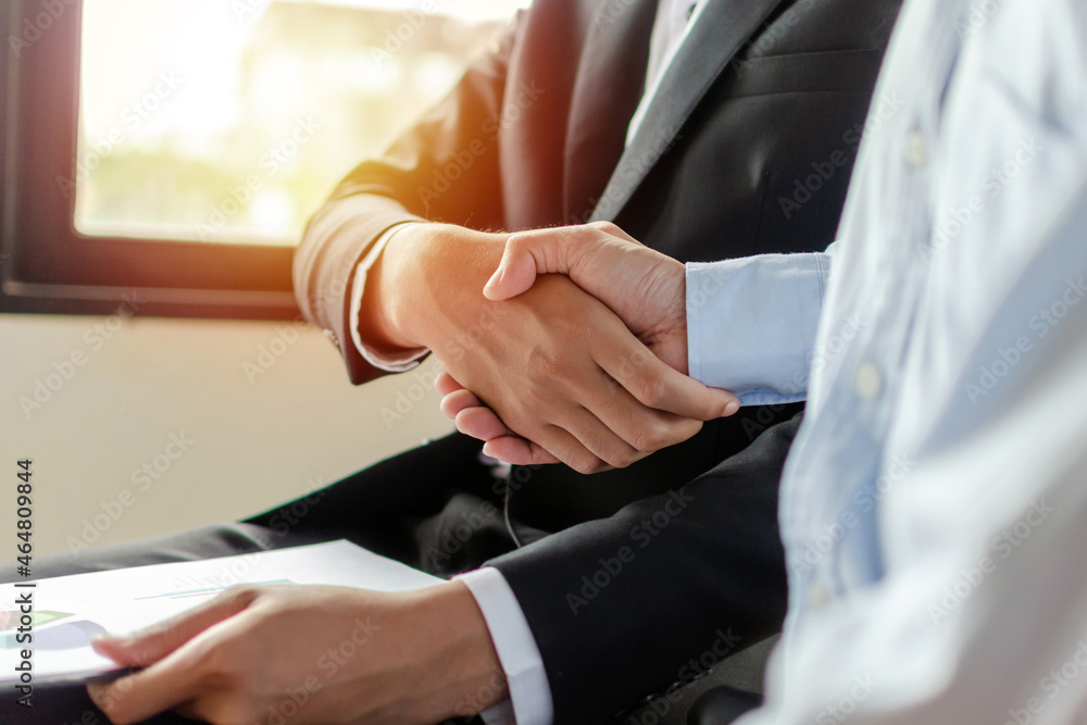 Fototapeta premium two business man investor handshake deal with partner after finishing up business meeting in meeting room office, partnership, partner, financial, teamwork, job interview, contract agreement concept