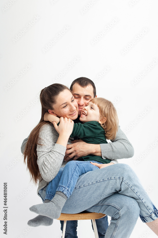 happy family isolates on a white background, smiling, hugging, kissing. Concept, lifestyle. happy family isolates on a white background, smiling, hugging, kissing. Concept, lifestyle.