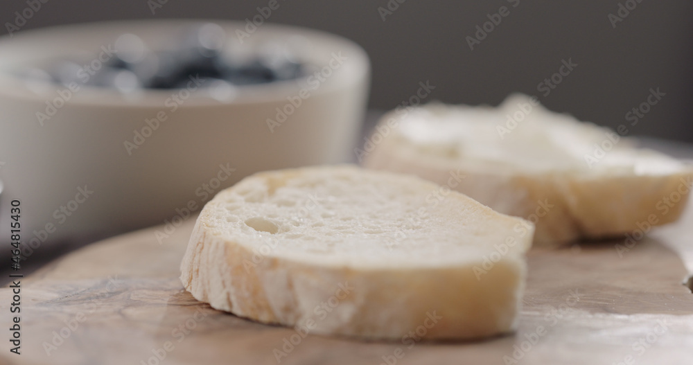 ciabatta bread slice on olive board