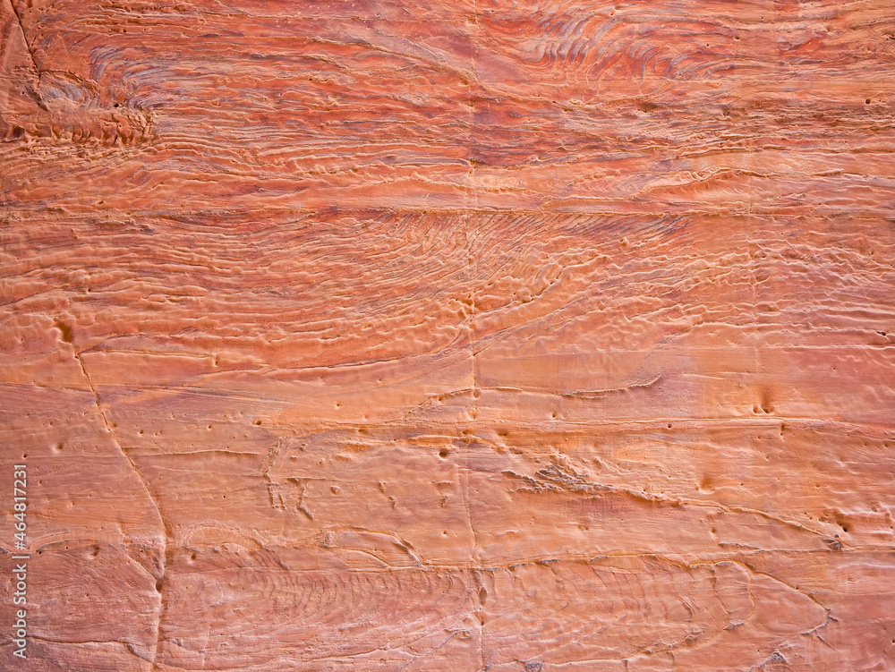 Red rock stone sand texture background. Red Stone wall in Petra, Jordan. Red rock stone sand texture background. Red Stone wall in Petra, Jordan.