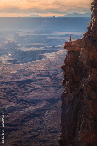 A man stand alone at a cliff looking canyon view, Canyonlands National Park