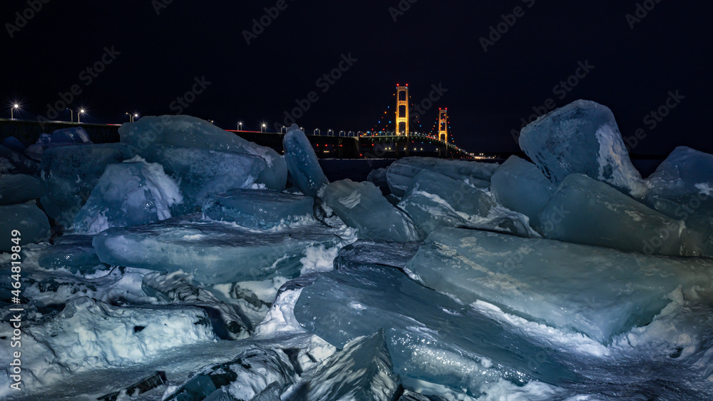 Night descends over Blue Ice blocks piling up at the Mackinac Bridge, near Mackinaw City, Michigan.