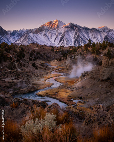 Beautiful Sunrise with Snow covered mountain in fall color season at Hot Creek Panorama, Mammoth Lakes, California
