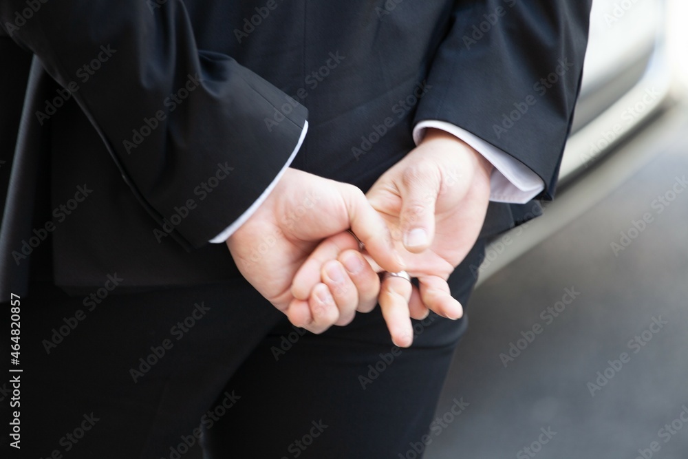 man holding his hands waiting