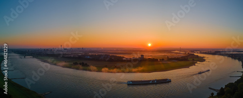 Panorama of rhine river in Düsseldorf with cruising ships at sunrise