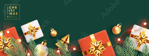 Christmas design with horizontal border made of realistic fir branches, gift boxes, golden conical Christmas trees, balls and lights on deep green background. Xmas banner, poster, card, website header