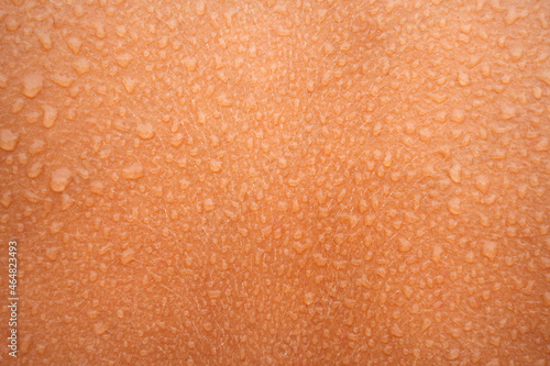 Water or sweat drops on human skin. Wet skin photo