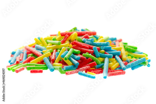 Rainbow sprinkle for confectionery. Colorful confetti on a white background, close-up. Confectionery multi-colored sprinkles for decoration. Pile of confectionery sprinkles. Confectionery decor.