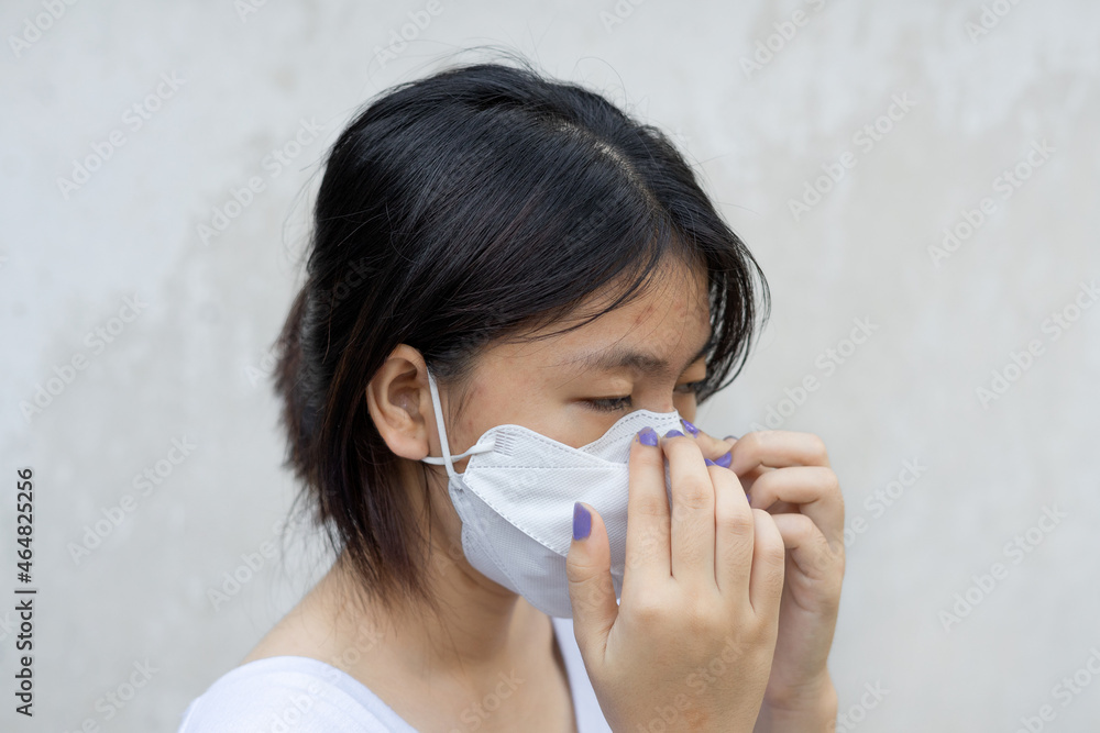 portrait Asian girl wear medical kf94 mask properly on white background. close up isolated portrait Asian girl wear medical kf94 mask properly on white background. close up isolated