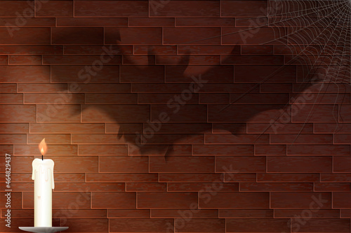 Halloween background with scary shadow of the bat on the brick wall.