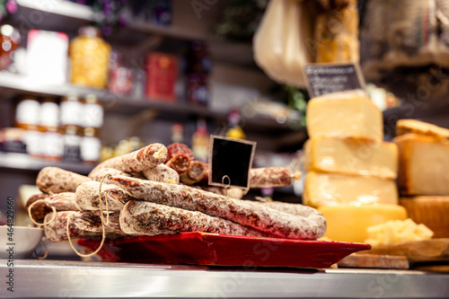 Italian food market with cheese and pepperoni, salsicella dolce, Tuscan delicatessen stall display, Florence, Italy