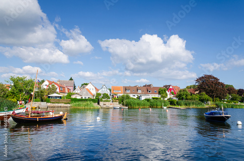 Tableau sur toile Boat at the Schlei river in Holm village of Schleswig, Germany