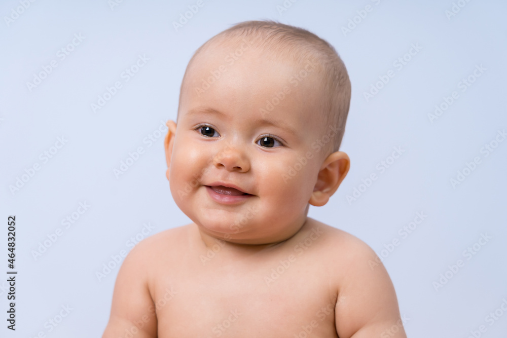 Portrait of smiling newborn baby 7-10 months on white background Portrait of smiling newborn baby 7-10 months on white background