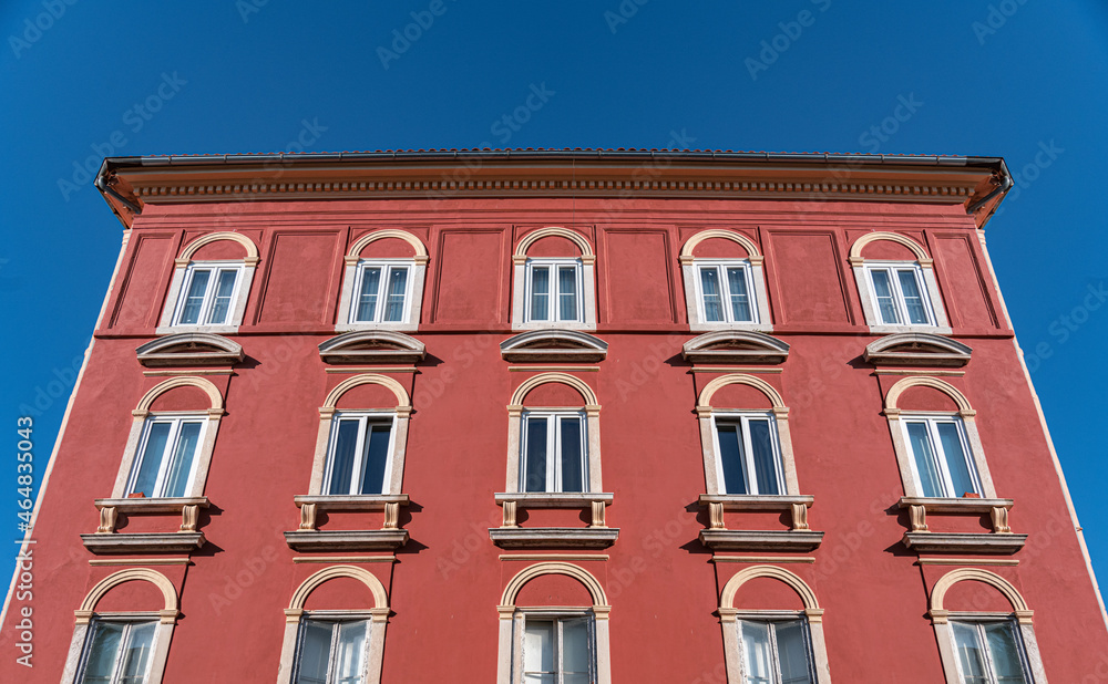 Fototapeta premium Part of an old multi-storey building in red.