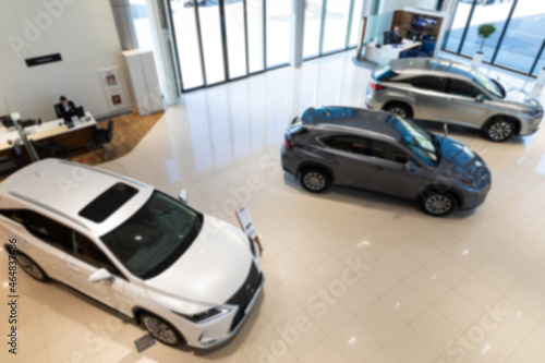 stylish modern car showroom, dealer office with new cars inside, blur photo for background