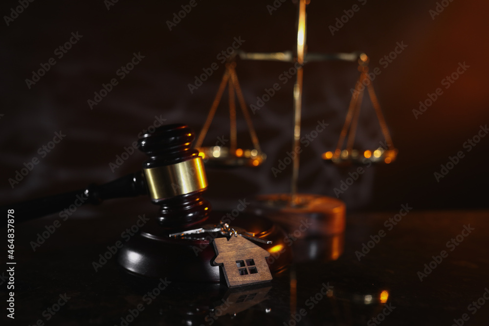 Law and Justice. Judge gavel and wedding rings close-up